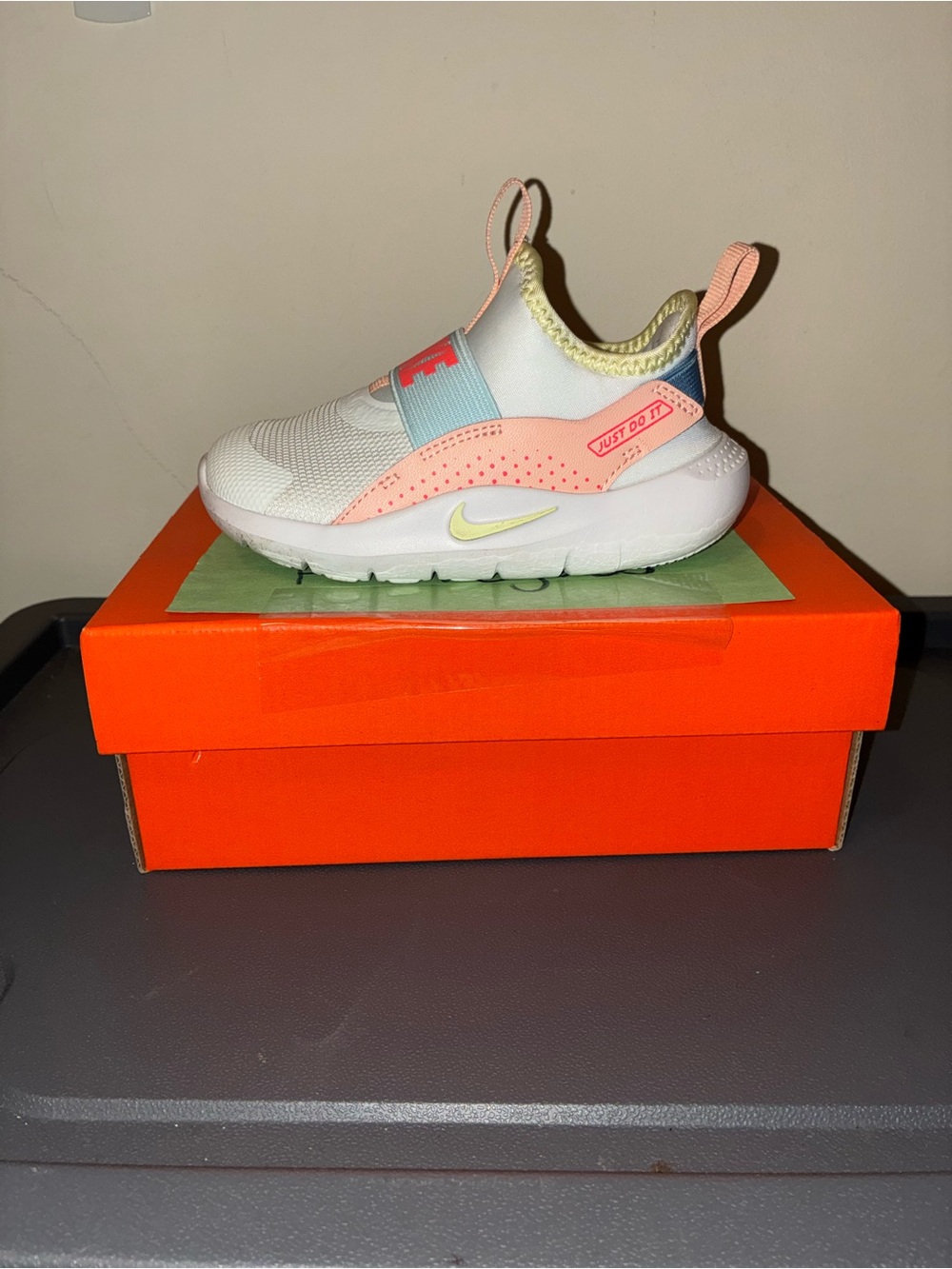 Nike Kids Slip-On Sneaker in White with Coral, Sky Blue & Yellow Accents